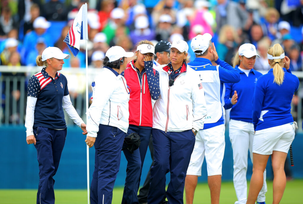 Alison Lee is consoled after losing her match in the fourth session at the 2015 Solheim Cup