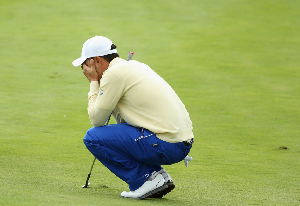 Sang-moon Bae looks dejected after a poor chip shot on the final hole on Sunday at the 2015 Presidents Cup