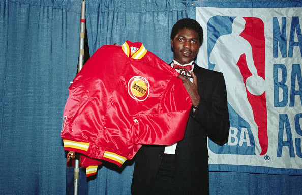 Hakeem Olajuwon after being selected No.1 overall by the Houston Rockets in the 1984 NBA Draft.