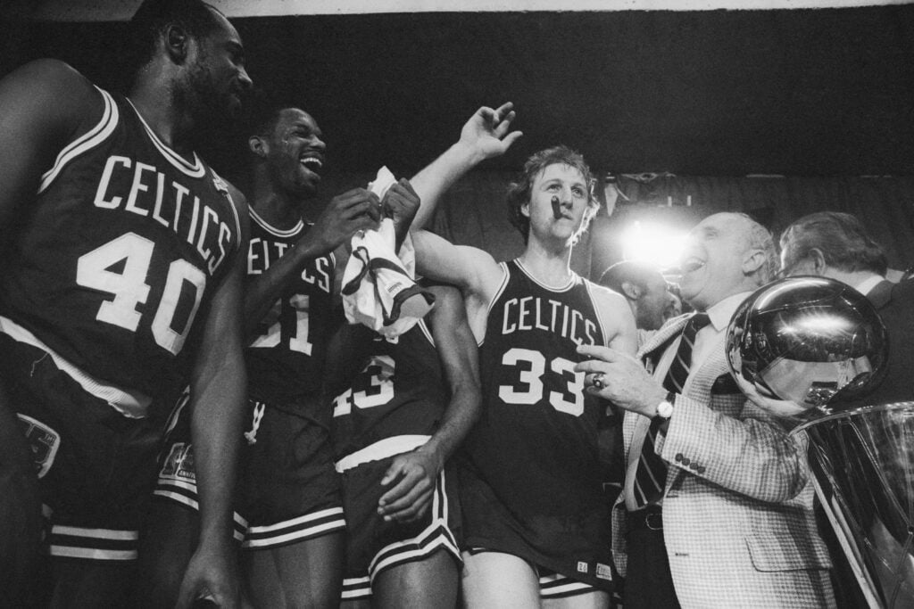 Larry Bird smoking a cigar after winning the 1981 NBA Championships with the Boston Celtics.