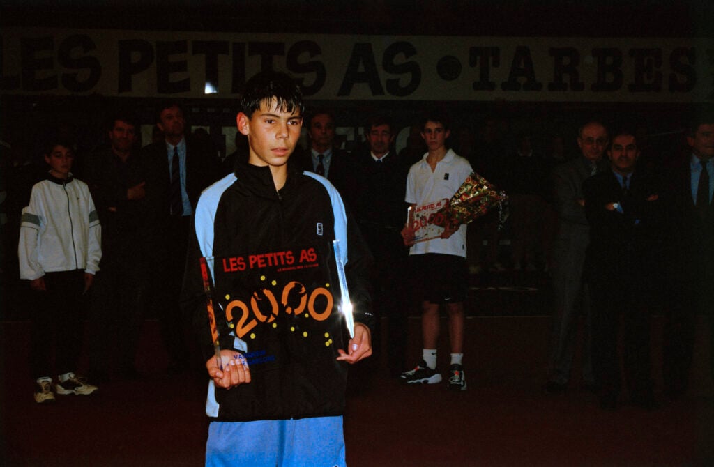 Rafael Nadal from Spain with the trophy after winning the 2000 Les Petits As tournament.