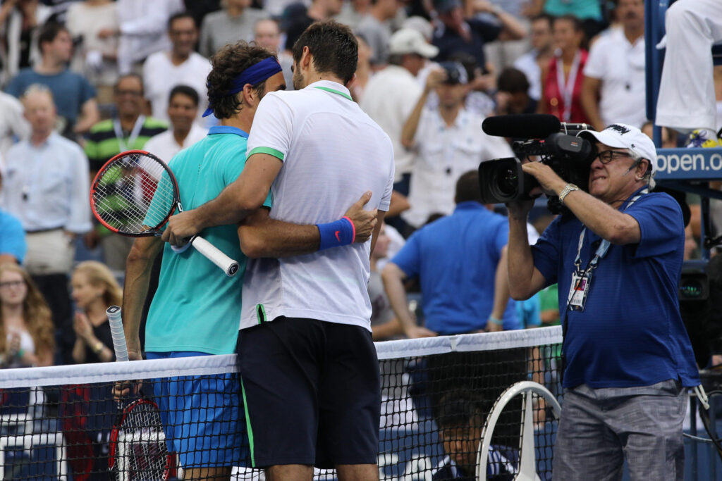 Roger Federer and Marin Cilic embracing at the 2018 US Open