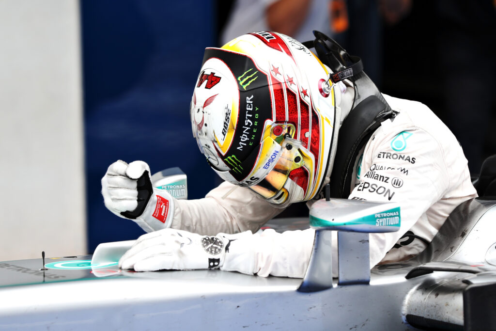 Lewis Hamilton celebrates in his Mercedes Formula 1 car after winning the 2016 Austrian Grand Prix.