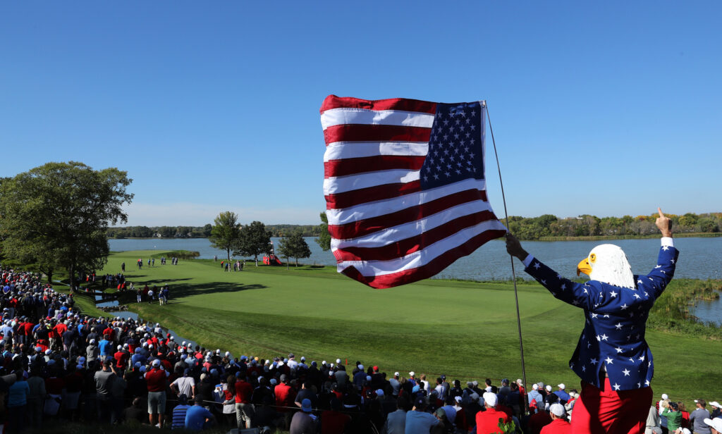 A fan wearing an eagle mask cheers during afternoon fourball matches of the 2016 Ryder Cup