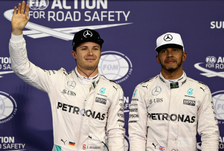 Nico Rosberg and Lewis Hamilton stand together after qualifying for the 2016 Grand Prix of Abu Dhabi.