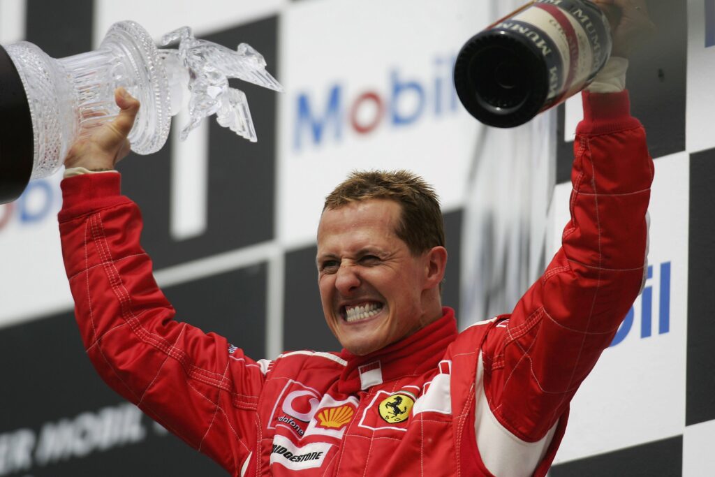 Michael Schumacher of Germany and Ferrari celebrates on the podium after winning the German Formula One Grand Prix