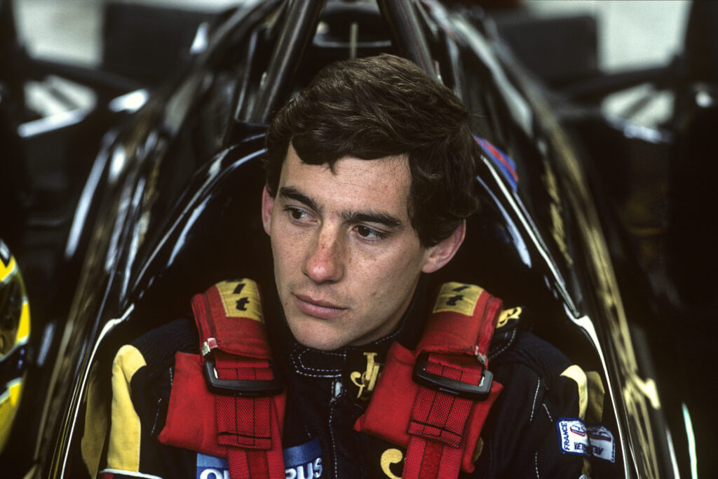 Lotus driver Ayrton Senna sitting in his car at the 1985 Belgian Grand Prix
