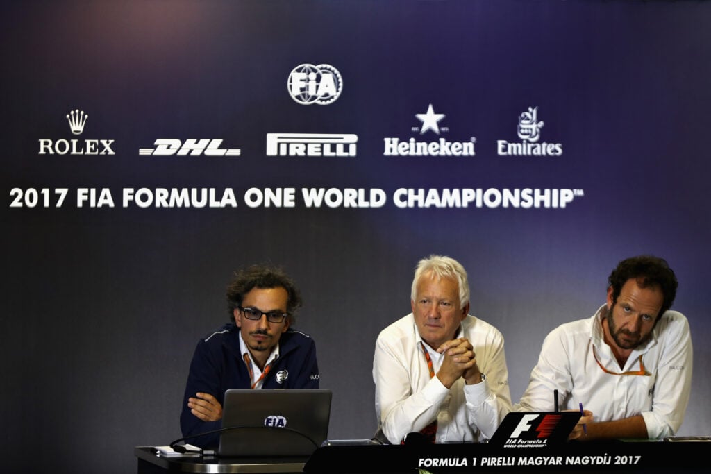 Charlie Whiting and Laurent Mekies talk in a press conference