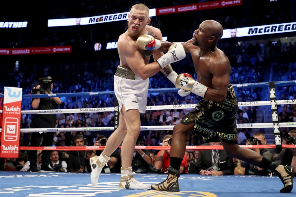 Floyd Mayweather Jr. throws a punch at Conor McGregor