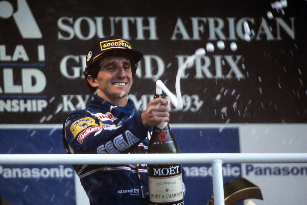 Alain Prost celebrates after winning the 1993 Grand Prix Of South Africa.