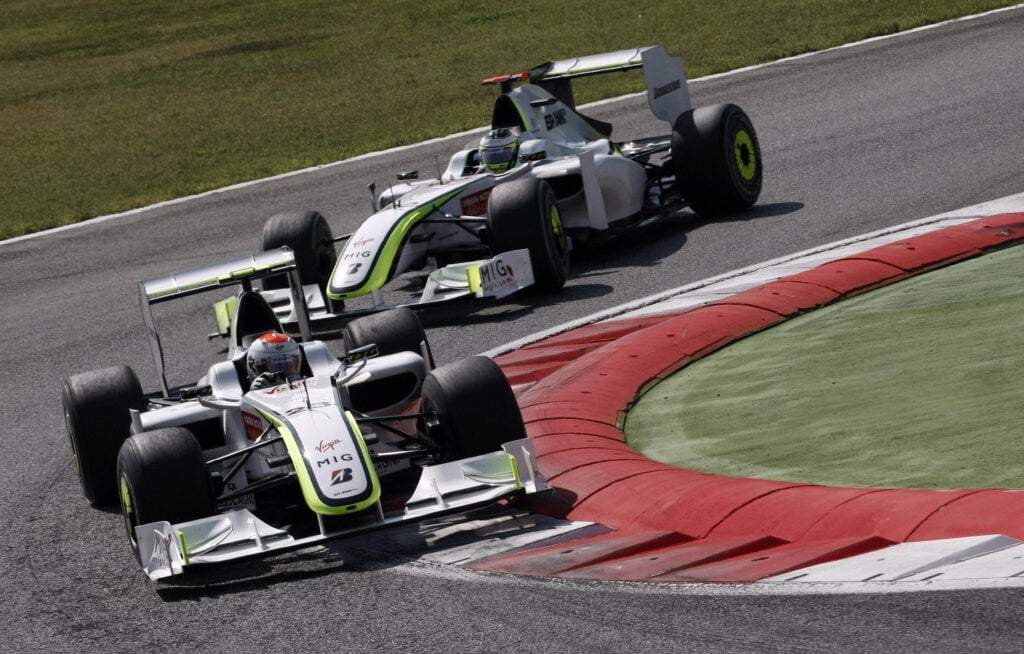 Brawn's Rubens Barrichello leads teammate Jenson Button round a corner at the 2009 Italian Grand Prix