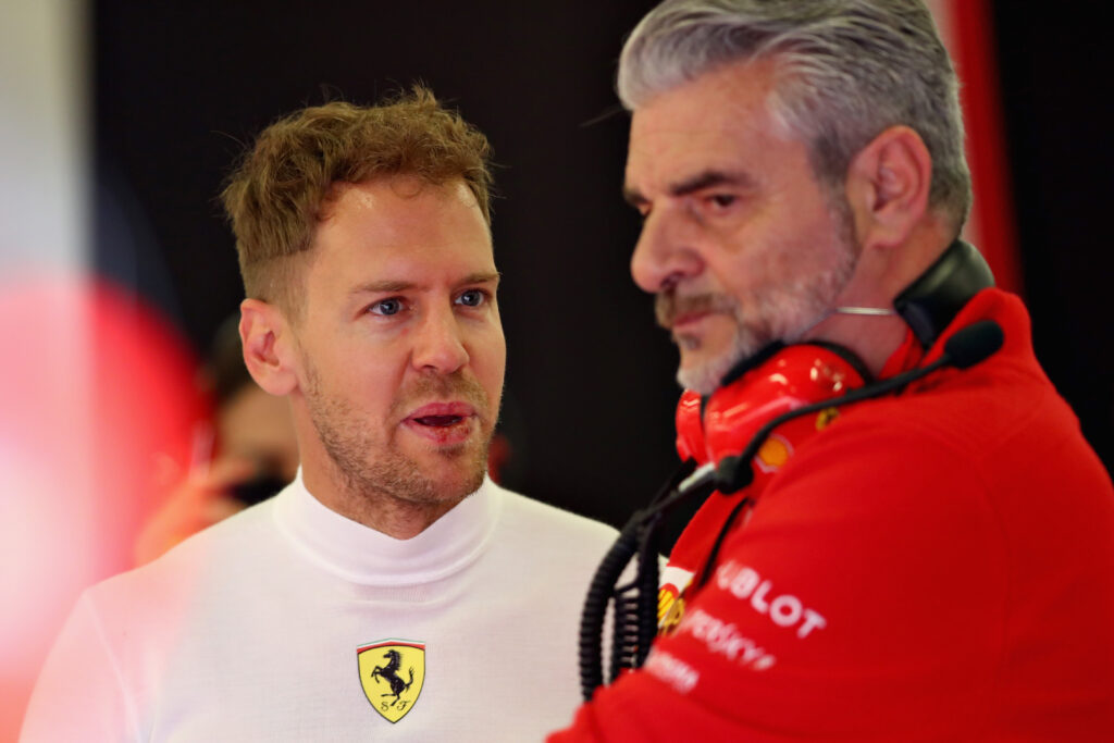 Maurizio Arrivabene speaks with Sebastian Vettel