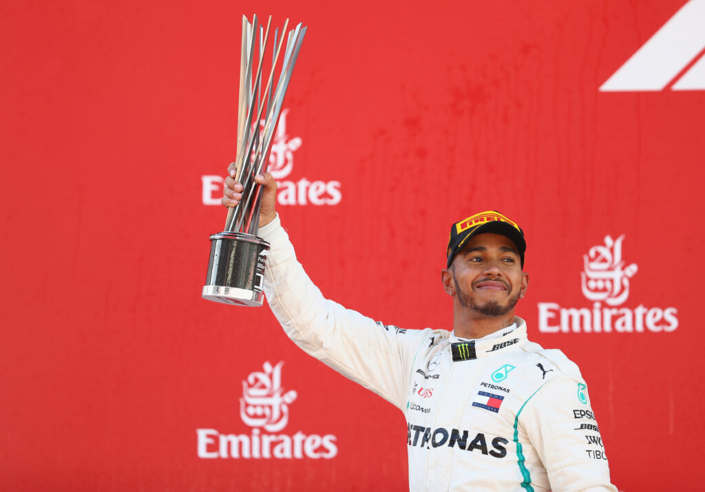 Lewis Hamilton celebrates on the podium after winning the 2018 Spanish Grand Prix with Mercedes.