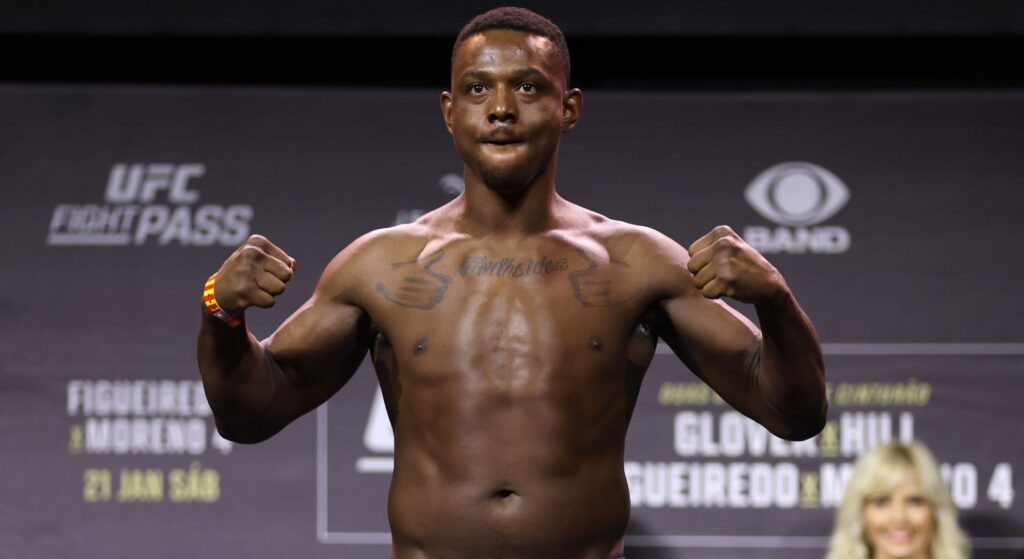 Jamahal Hill poses on the scales ahead of UFC 283