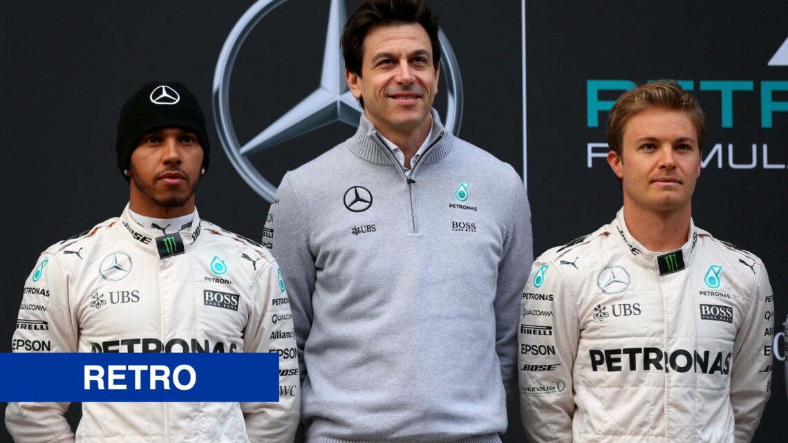 Toto Wolff, Lewis Hamilton and Nico Rosberg pose together outside the Mercedes Formula 1 garage ahead of 2016 winter testing.