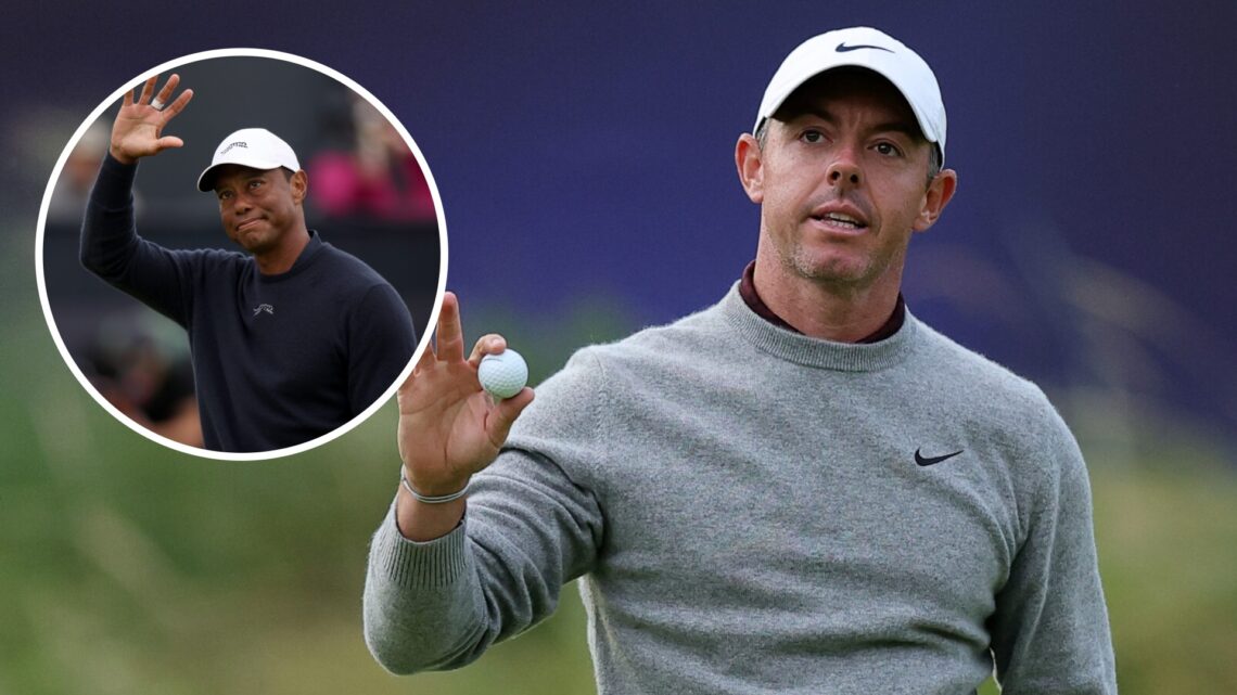 Rory McIlroy (right) acknowledges the crowd and Tiger Woods (left) acknowledges the crowd