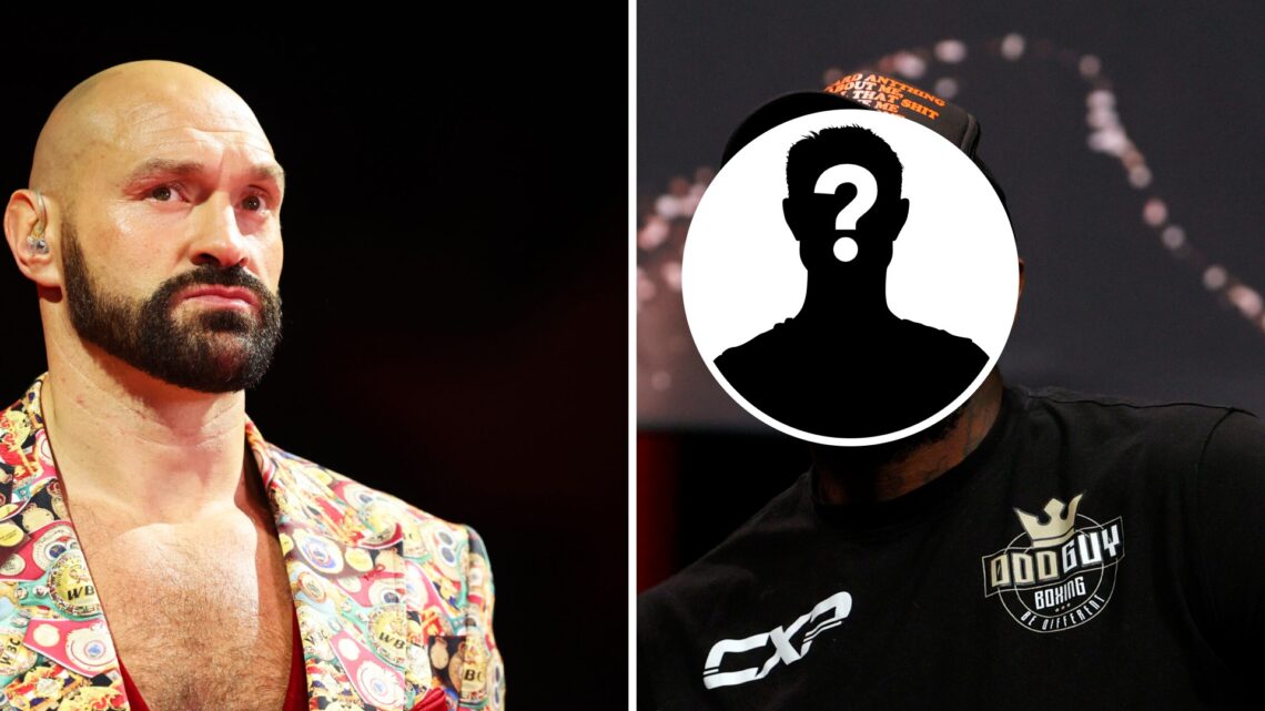 Tyson Fury is interviewed by DAZN, Malik Scott attends the press conference for Tyson Fury vs Deontay Wilder, mystery figure covering Scott's face