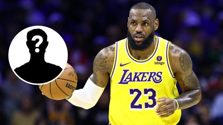 LeBron James (right) of the Los Angeles Lakers dribbles the basketball and a mystery person (left)