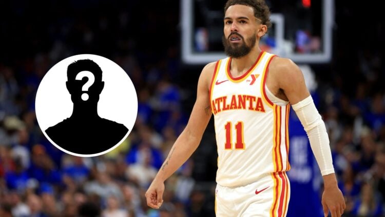 Trae Young #11 of the Atlanta Hawks looks on (right) and a mystery person (left)