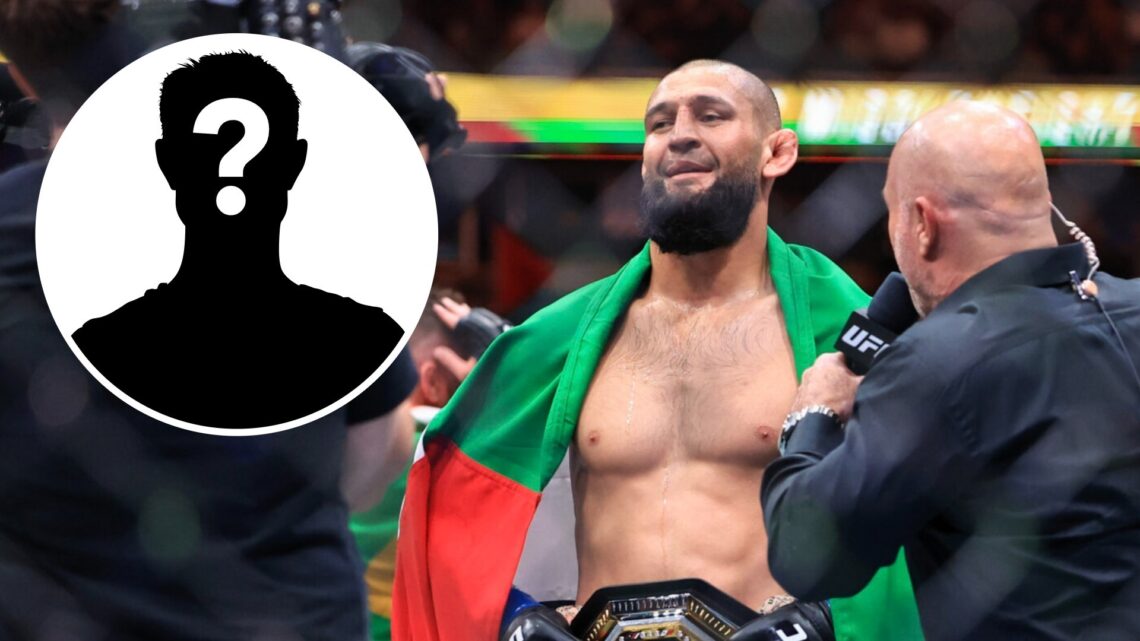Khamzat Chimaev (left) holds up Dubai flag and speaks to Joe Rogan after UFC 319 win